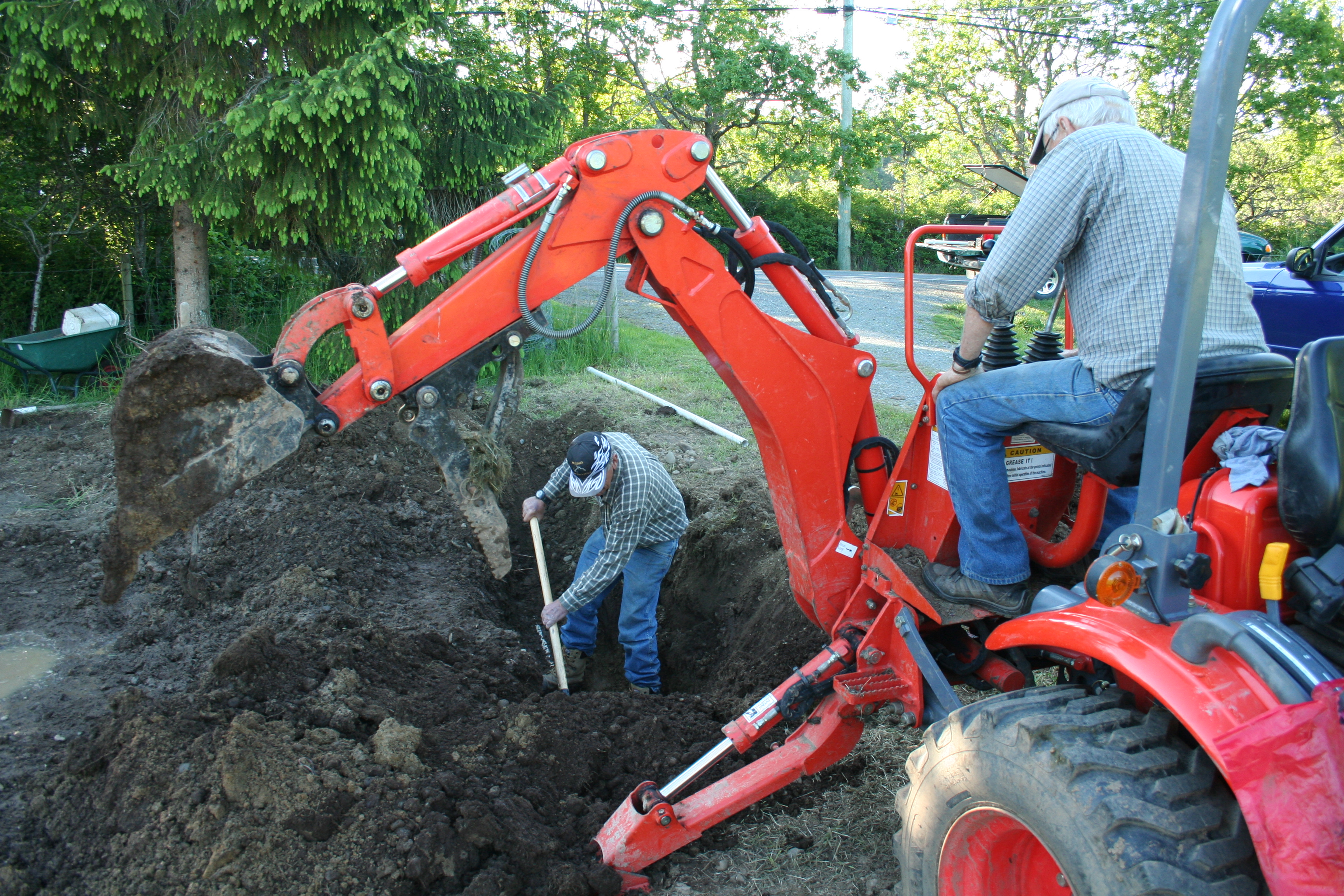 Garry (Alex's father) and Larry (friend and neighbor) save the day digging out the water line